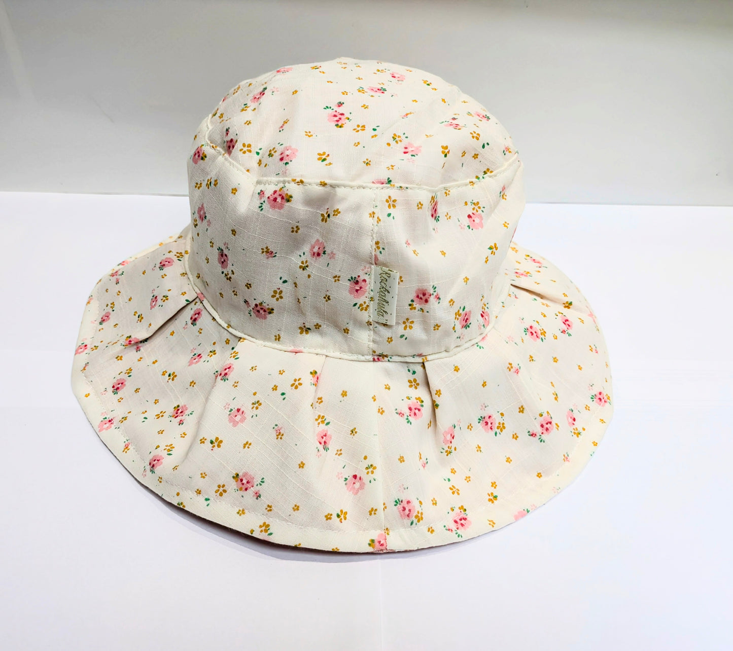 A white floral sun hat by Rockahula on a white background
