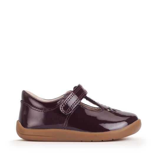 A girls shoe by Start-Rite, stye Puzzle, in burgundy with heel and toe bumpers and t bar with velcro strap. Right side view