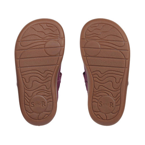 A girls Mary Jane shoe by Start Rite, style Fairy Tale, in plum leather with flower detail and velcro fastening. Sole view.