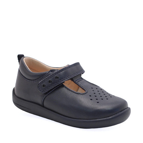 A unisex T-Bar shoe by Start-Rite, style Jigsaw, in navy leather with punch out detail. Angled view.