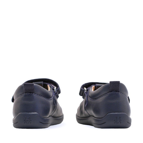A pair of unisex T-Bar shoes by Start-Rite, style Jigsaw, in navy leather with punch out detail. View of back.