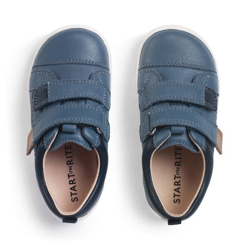 A boy's casual shoe by Start-Rite, style Playhouse, in blue leather with tan trim on white sole unit with double velcro fastening. View from above of a pair.