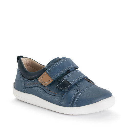 A boy's casual shoe by Start-Rite, style Playhouse, in blue leather with tan trim on white sole unit with double velcro fastening. Angled view.