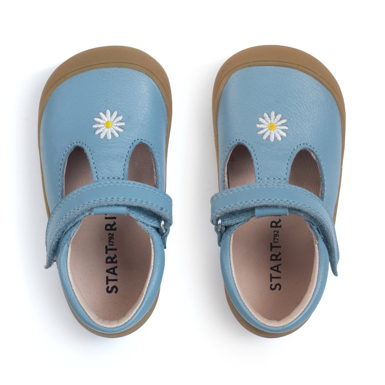 A girls T-Bar first shoe by Start-rite, style Floret, in blue leather with flower detail and toe bumper. Velcro Fastening. View of pair from above.