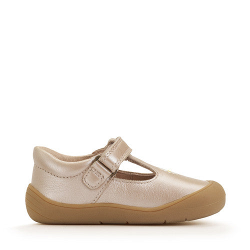 A girls T-Bar first shoe by Start-rite, style Floret, in pearlised taupe leather with flower detail and toe bumper. Velcro Fastening. Left side view.