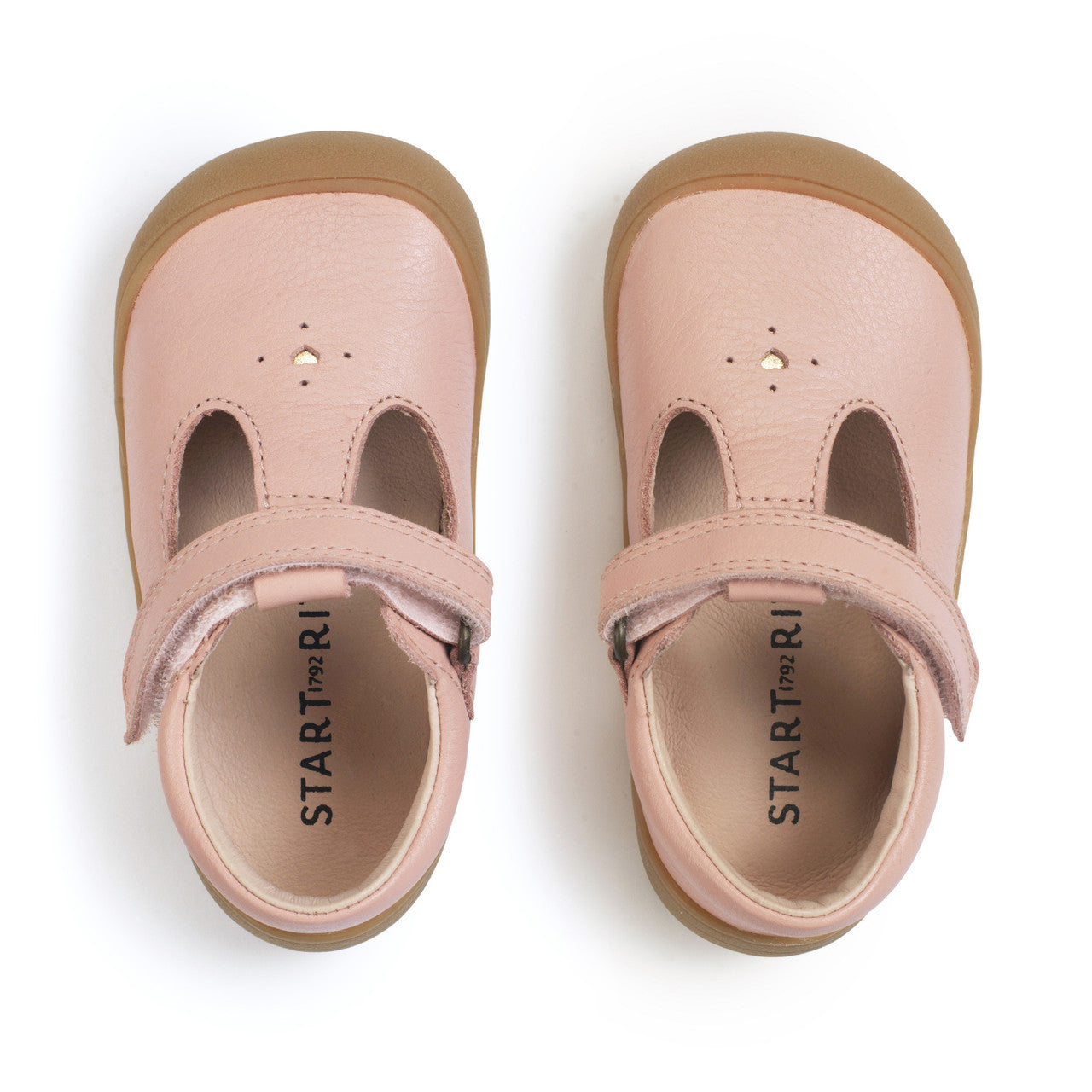 A girls shoe by Start-Rite, style Charms, in dusky pink with t-bar, velcro strap and front and back bumpers. Top view of pair