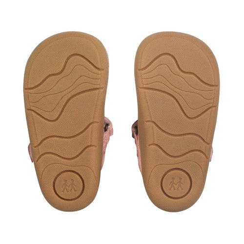 A girls shoe by Start-Rite, style Charms, in dusky pink with t-bar, velcro strap and front and back bumpers. Sole view of pair