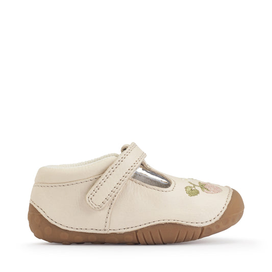 A girls pre-walker shoe by StartRite, style squish in cream with strawberry detail on front and t-bar velcro strap. Right side view