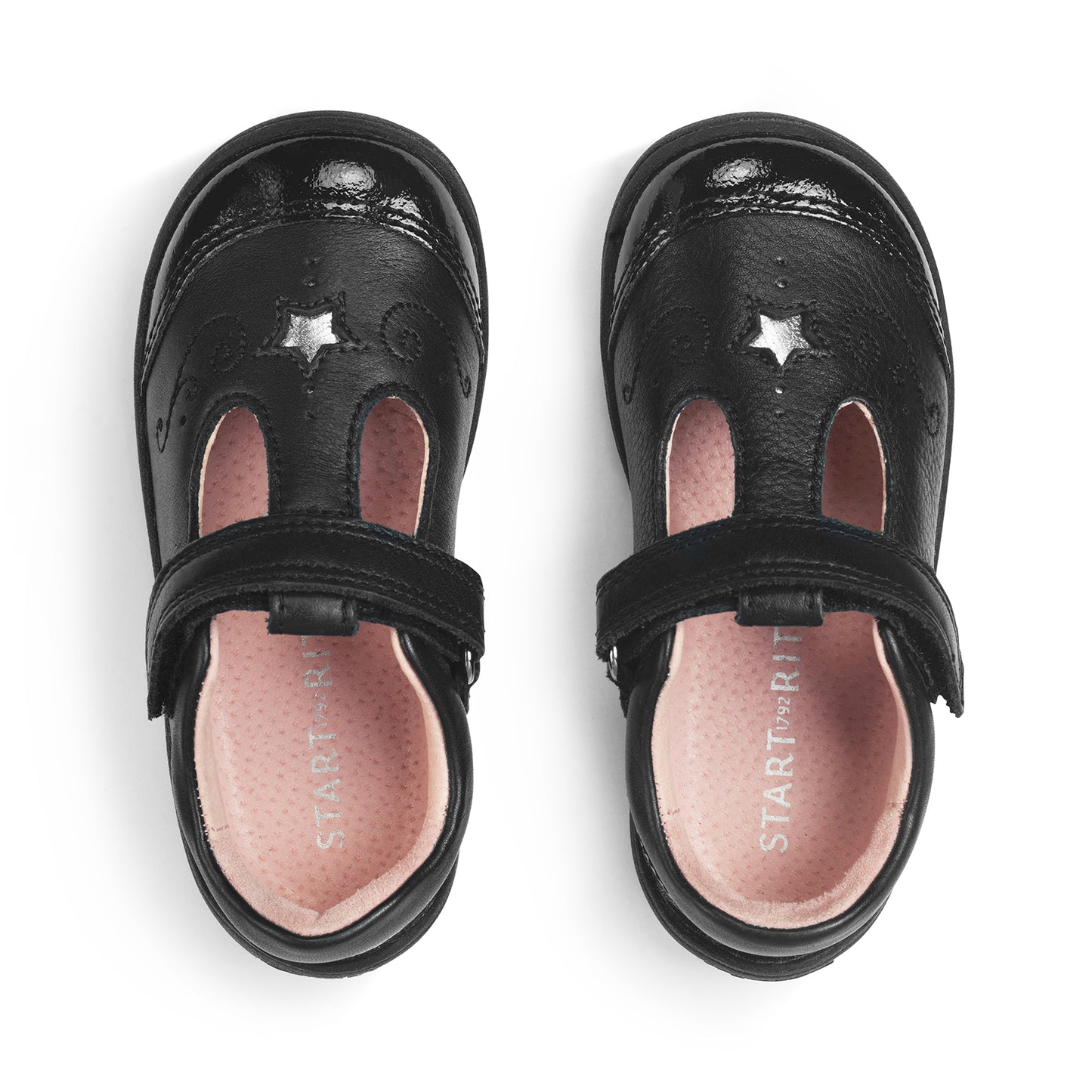 A girls T-Bar school shoe by Start-Rite, style Dazzle, in black leather with patent trim and star detail. Velcro fastening. View of pair.