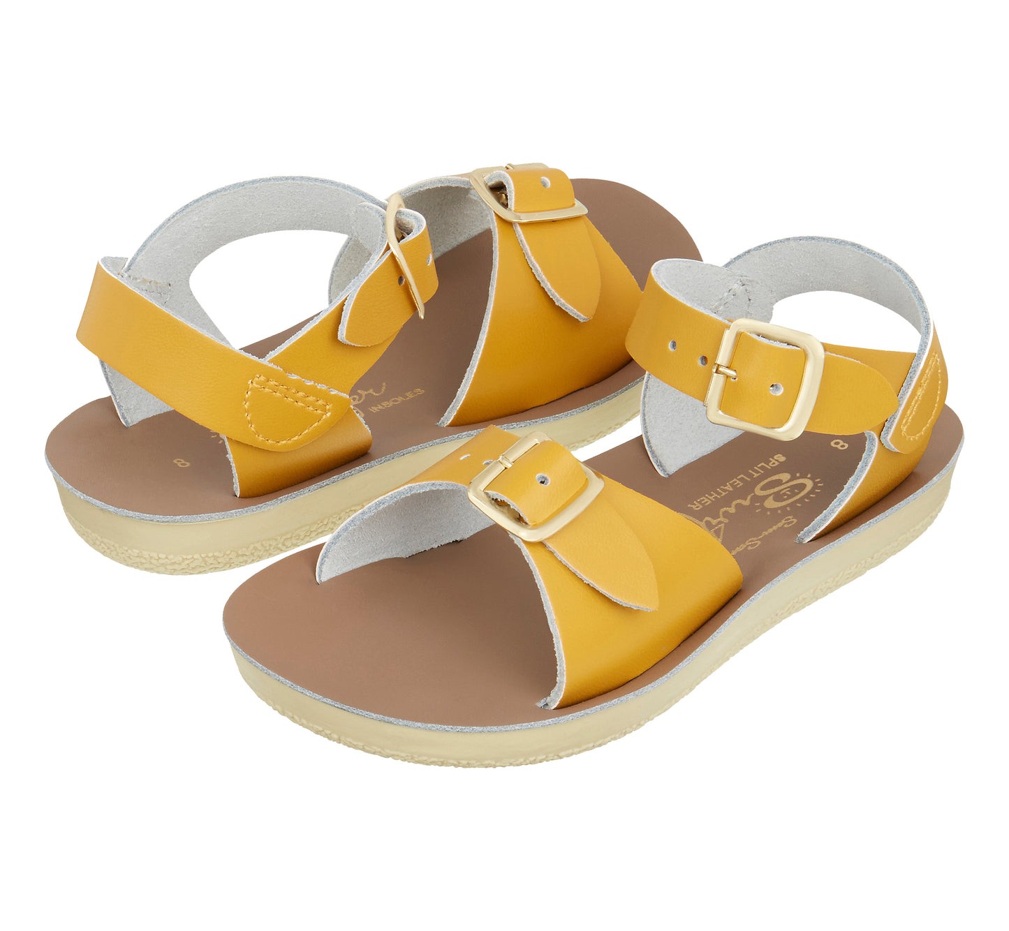 A unisex sandal by Salt Water Sandals in mustard with double buckle fastening across the instep and around the ankle. Open Toe and Sling-back. Pair view.