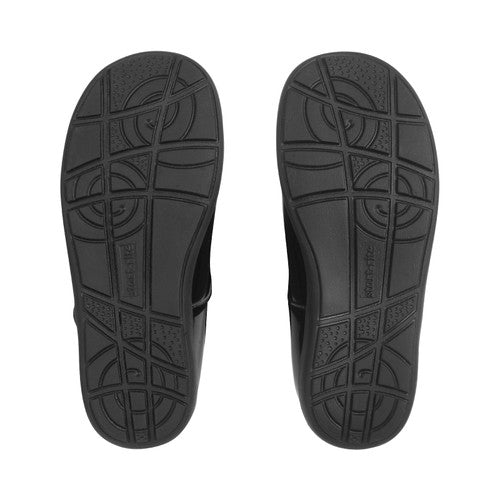 A girls Mary Jane school shoe by Start Rite, style Emily, in black patent with punch out flower detail and velcro fastening. View of sole of a pair.