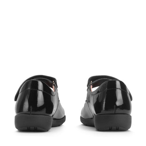 A girls Mary Jane school shoe by Start Rite, style Emily, in black patent with punch out flower detail and velcro fastening. View of pair from back.