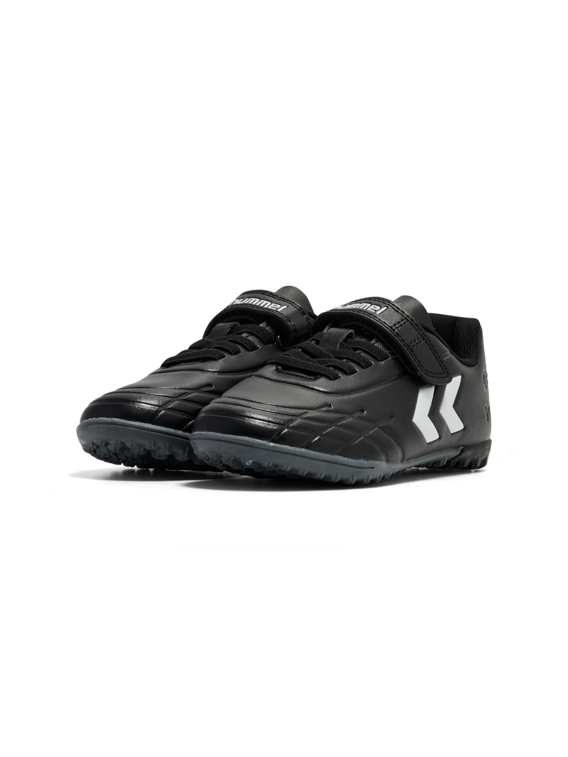 A astro turf football boot by Hummel, style Top Star Turf JR 228343-2267 in black with white trim with velcro fastening. Angled left side view of a pair.