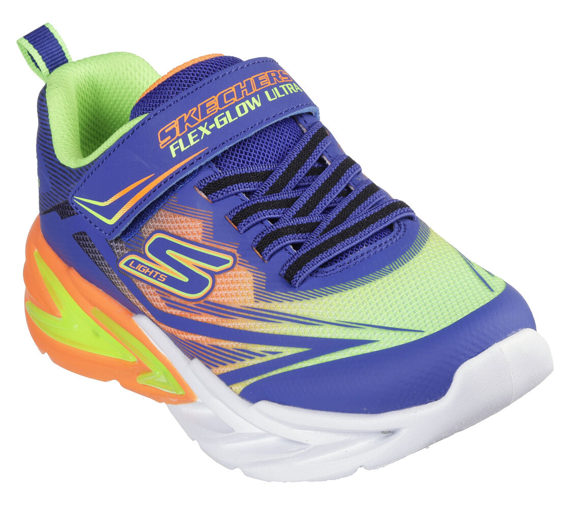 A boys light up trainer by Skechers, style 400139L Flex Glow Ultra, in blue multi with light up sole . Velcro and elastic lace fastening. Angled view.