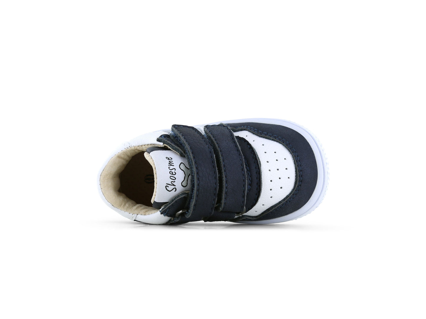 A boys mid top trainer by Shoesme, style BN25S006-B in white and navy, double velcro straps. View of top on it's side.