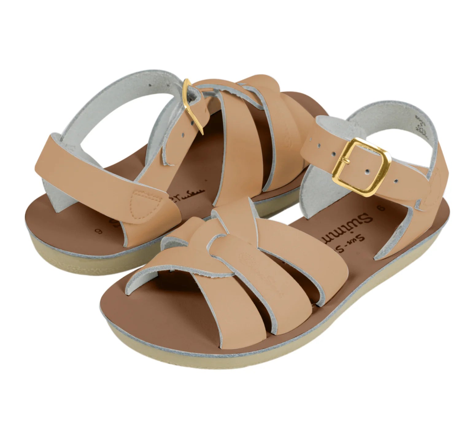 A unisex sandal by Saltwater, style swimmer in Latte with gold buckle strap. View of pair