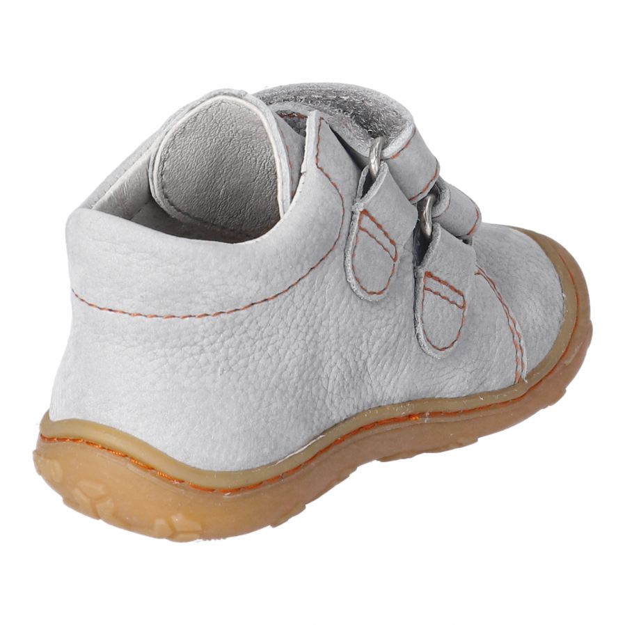 A unisex boot by Ricosta, with toe bumper in pale grey with double velcro fastening. Angled view.