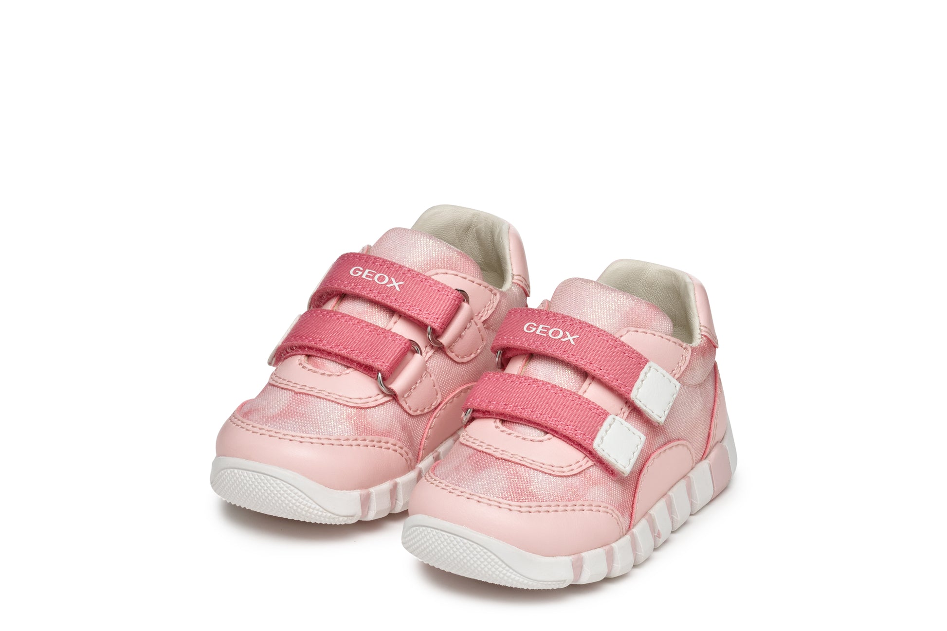 A girls shoe by Geox, style Iupidoo, in pink with double velcro fastening.  Angled left side view of pair.