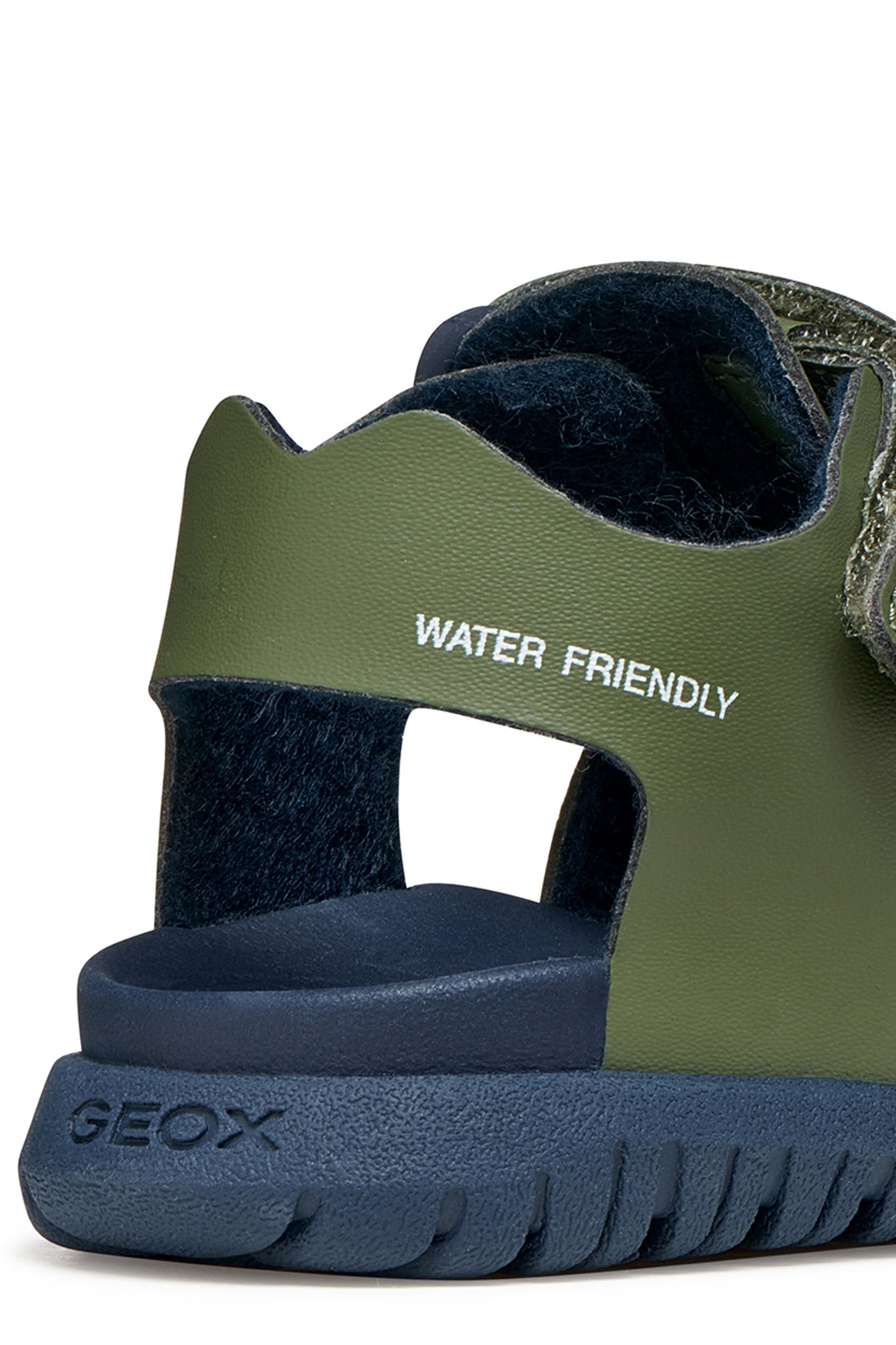 A boys sandal by Geox, style Fusbetto in sage/navy with sage body and navy sole. Zoomed image of heel