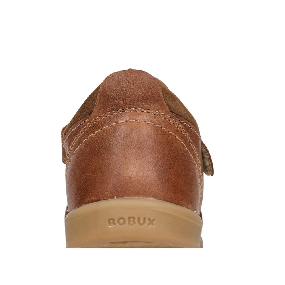 A unisex sandal by Bobux, style Roam in Caramel with velcro strap. Zoomed view of back heel with logo on sole