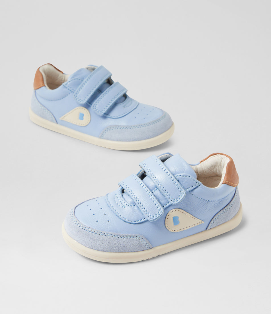 A unisex casual shoe by Bobux, style Champ (Step Up) in Skyway with two velcro stras, brown back ankle detail amd white sole. View of pair