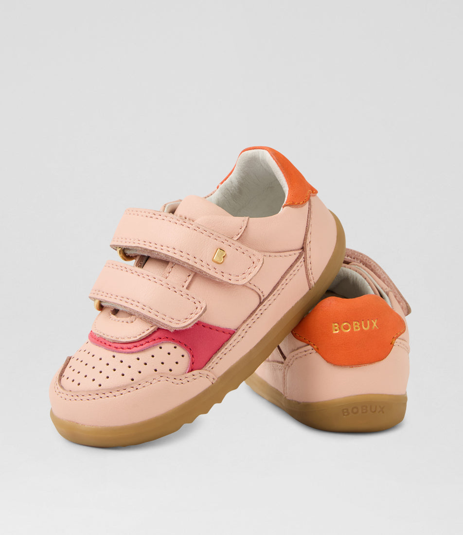 A girls casual shoe by Bobux, style Hunter (Step Up) in Cameo Rose/Nasturtium with two velcro straps and light brown sole. View of pair, one resting on the other