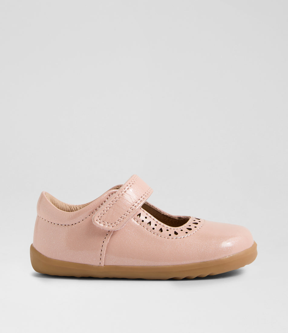 A girls casual shoe by Bobux, style Lola (Step Up) in Cameo Rose with velcro strap, cut out pattern detail and light brown sole. Right side view