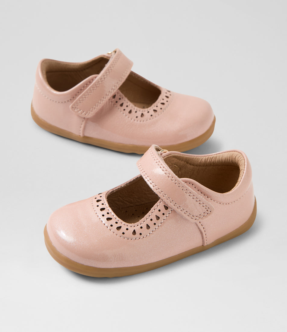 A girls casual shoe by Bobux, style Lola (Step Up) in Cameo Rose with velcro strap, cut out pattern detail and light brown sole. View of pair