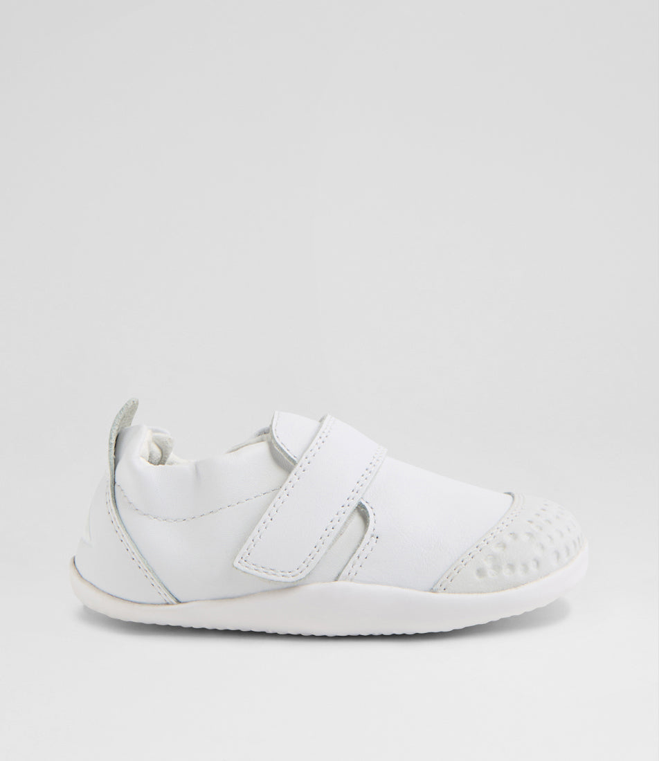 A unisex pre-walker shoe by Bobux, style Xplorer in white. With a velcro strap and front toe bumper. Right side view