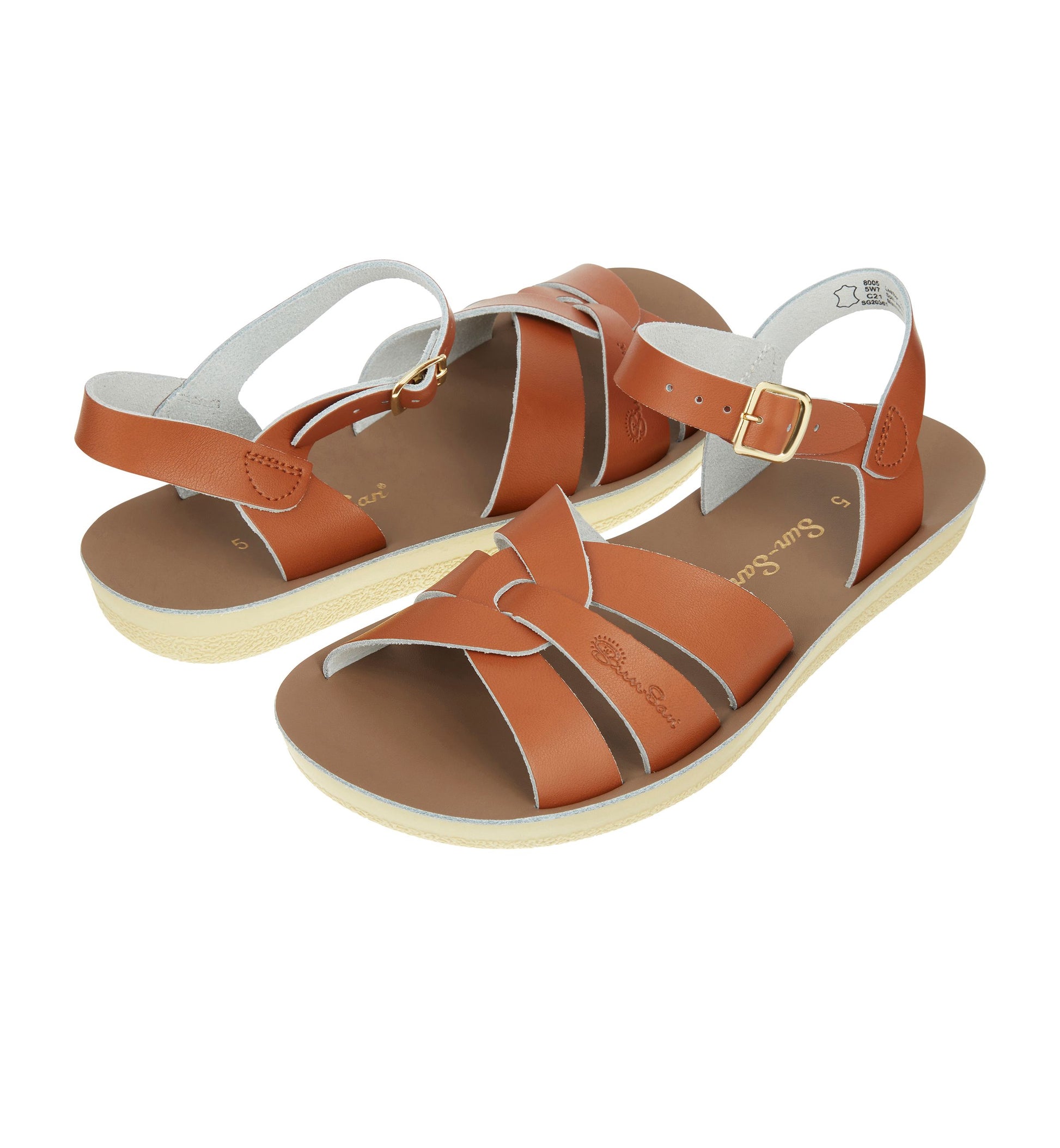 A unisex sandal by Salt Water, style Swimmer in tan, buckle fastening. Top to toe view of a pair.