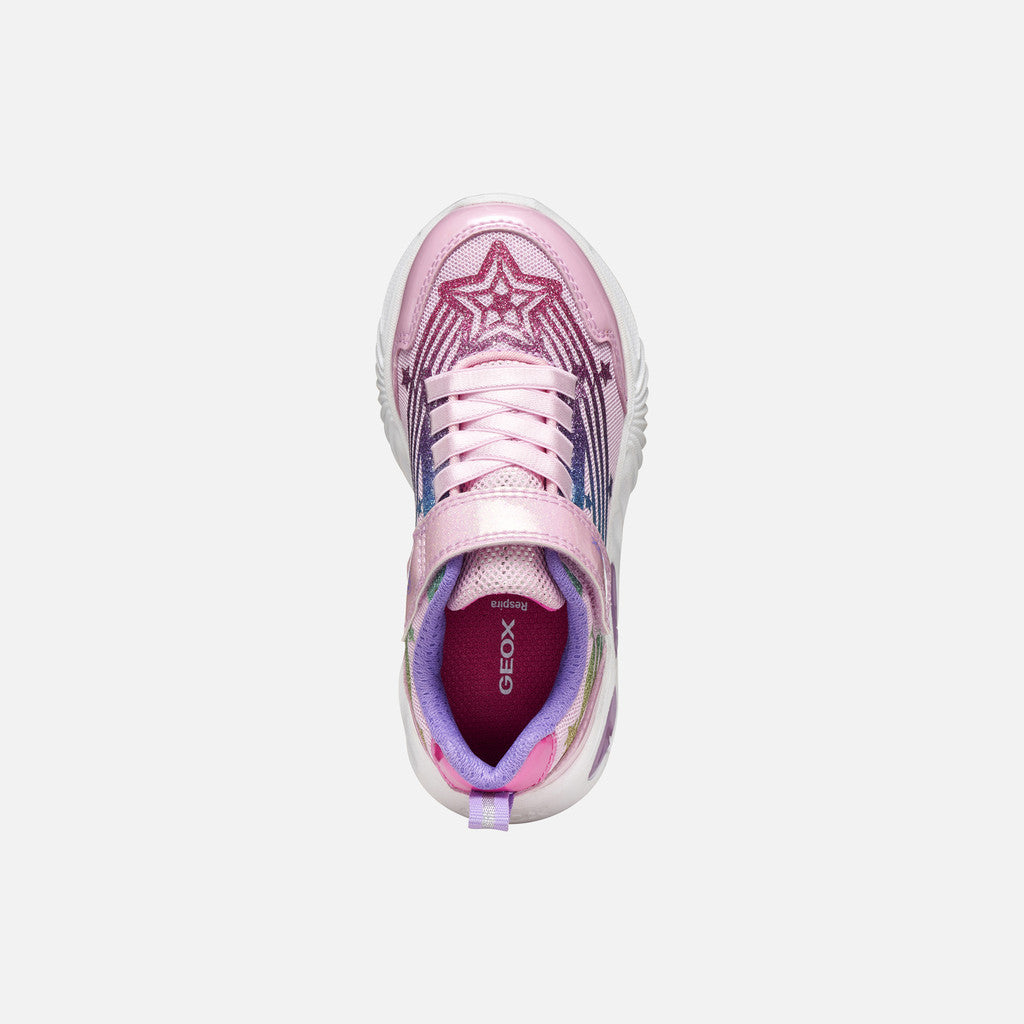 A pink girls trainer by Skechers, style Assister, in pink/multicolour with glittery rainbow and star design, velcro strap and pink laces. Right top view