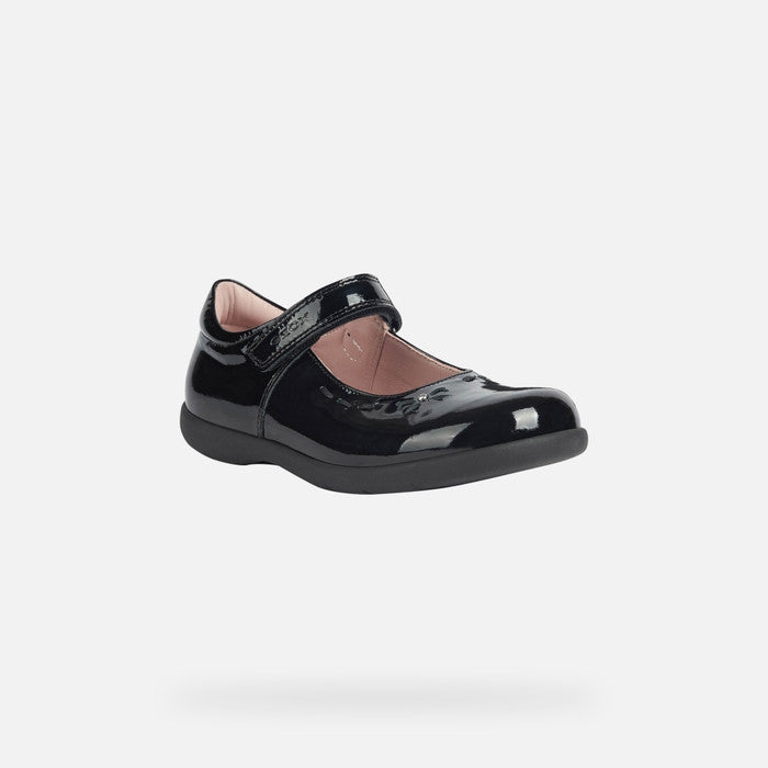 A girls Mary Jane school shoe by Geox, style Naimara, in black patent with velcro fastening. Angled view.