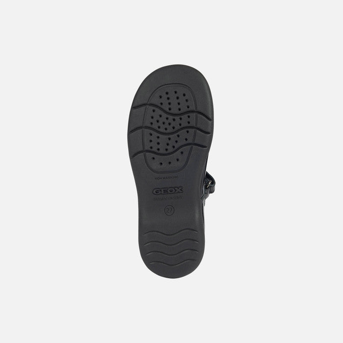 A girls Mary Jane school shoe by Geox, style Naimara, in black patent with velcro fastening. View of sole.