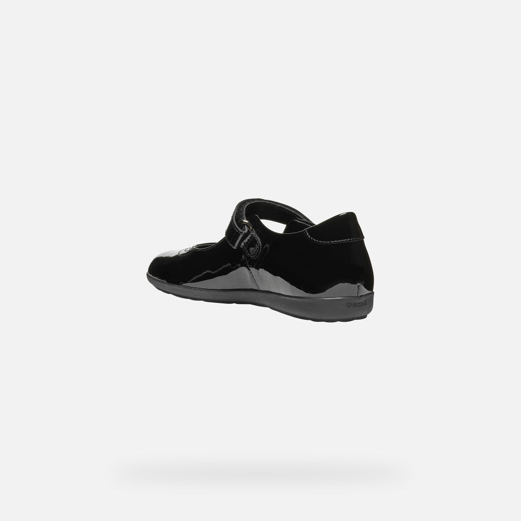 A girls Mary Jane school shoe by Geox, style J46MDG Iberide Girl, in black patent with punch hole detail and velcro fastening. Angled view left side.