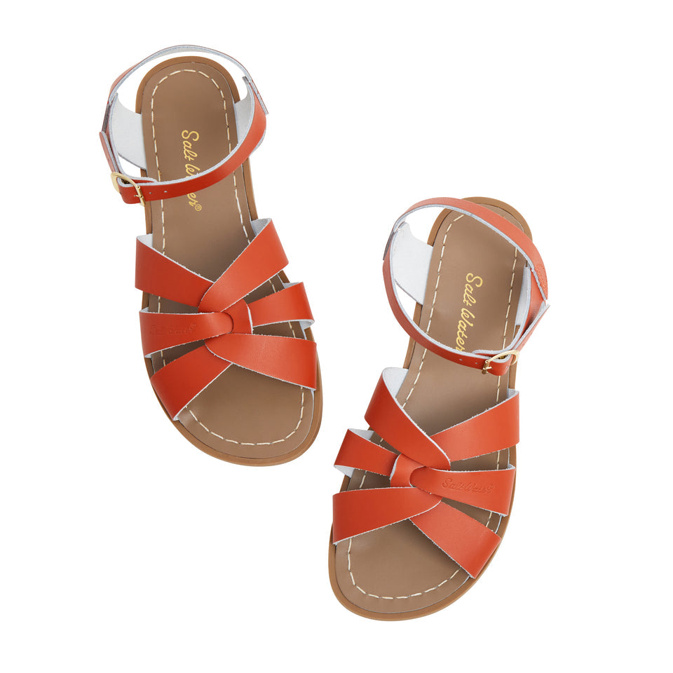 An original girls sandal by Salt Water Sandals in paprika with a single buckle fastening around the ankle. Open Toe and Sling-back with woven detail on the front. Top view.