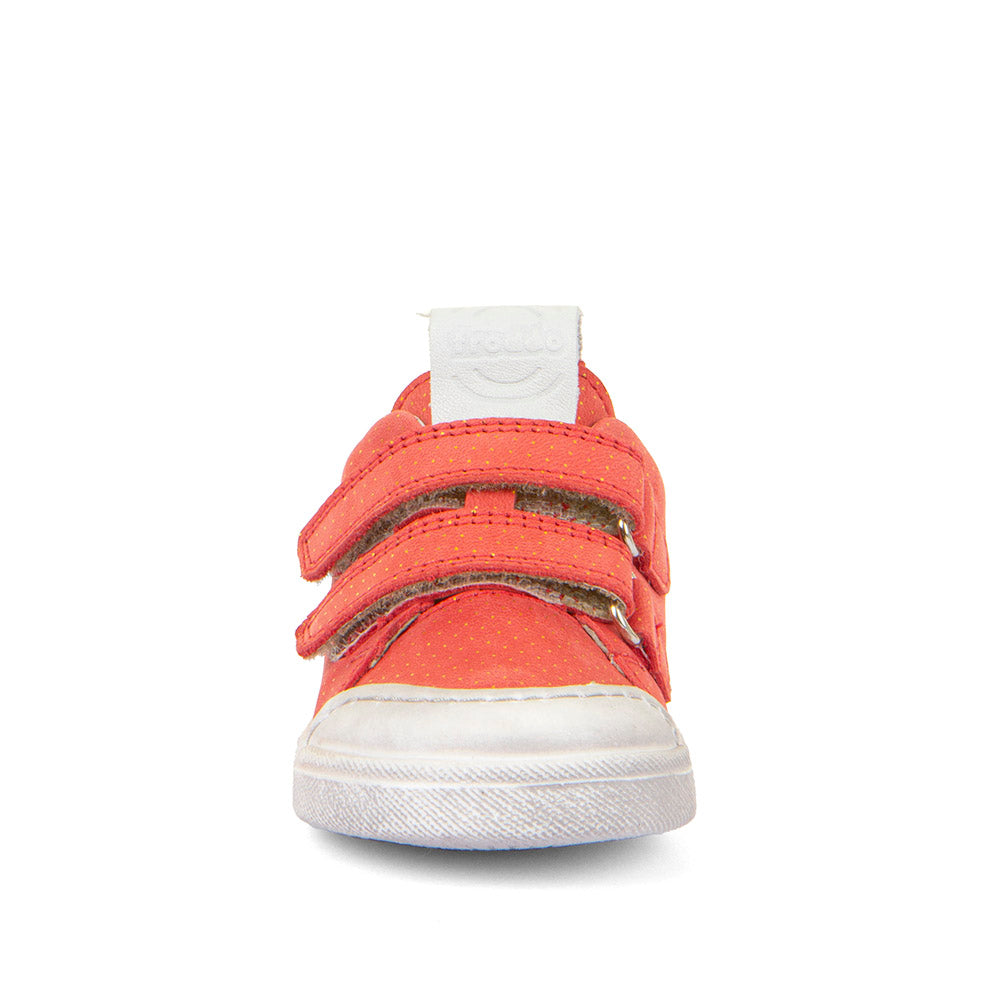 A girls casual shoe by Froddo, style Rosario G2130316-30, in coral leather with gold polka dots and white trim.
Toe bumper and velcro fastening. Front view.