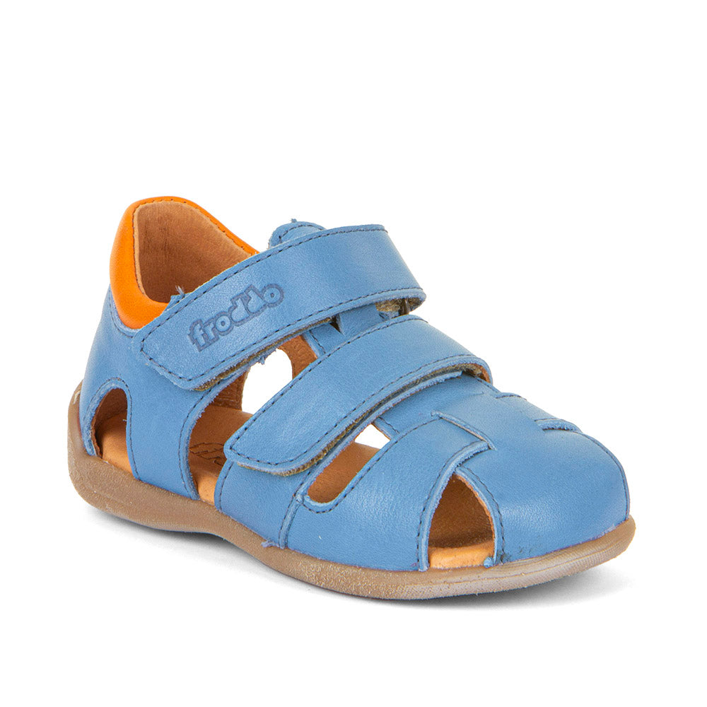 A boys closed toe leather sandal by Froddo, style Carte Double, in blue multi leather with velcro fastening. Angle view.