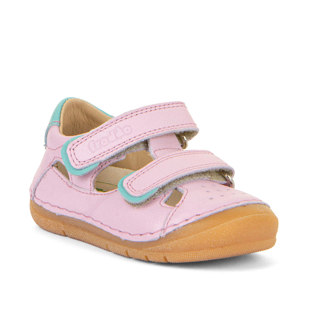 A girls closed toe sandal by Froddo, style Paix Double G2150198-6, in pink with blue trim and double velcro fastening. Angled view.