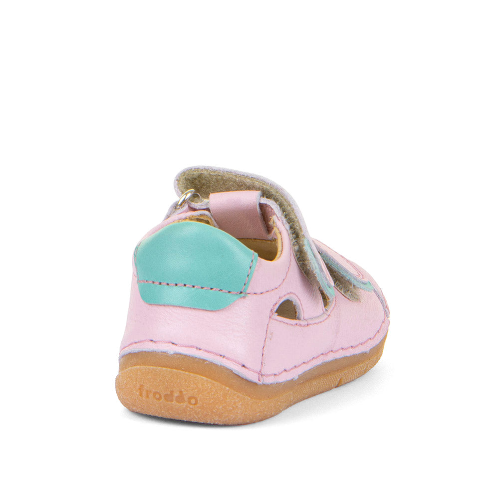 A girls closed toe sandal by Froddo, style Paix Double G2150198-6, in pink with blue trim and double velcro fastening. Angled back view.