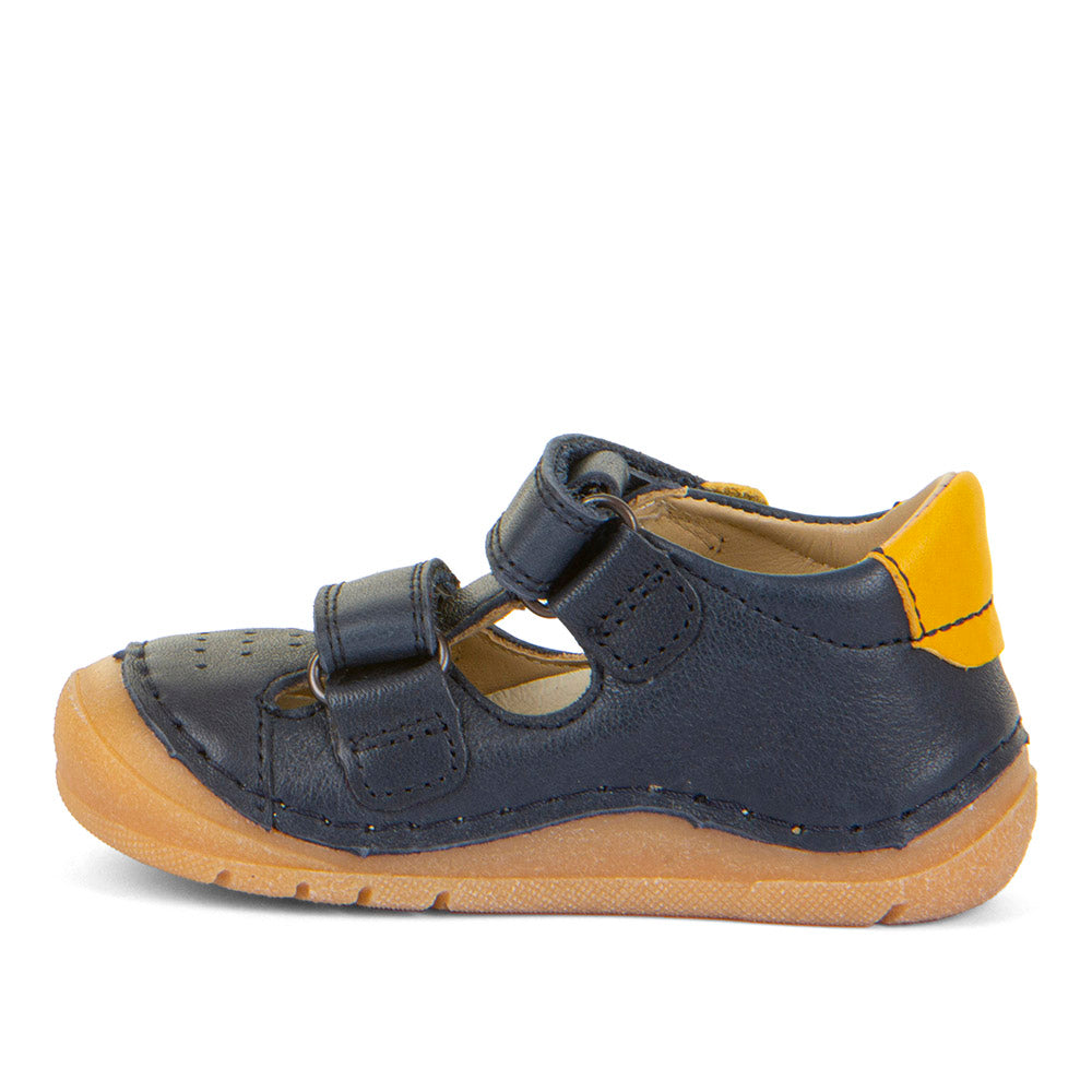 A boys closed toe sandal by Froddo, style Paix Double G2150198, in blue with yellow trim and double velcro fastening. Left side.