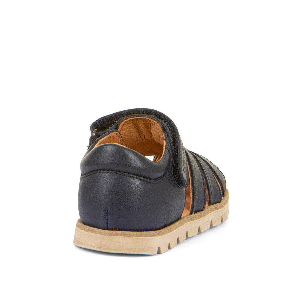 A unisex closed toe sandal by Froddo,style Keko G3150287 in navy with velcro fastening.  Angled view rom back.