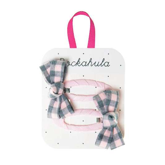 A pair of girls hair clips by Rockahula, style Annie Check, pink grosgrain clips with grey and pink check bows at each end.