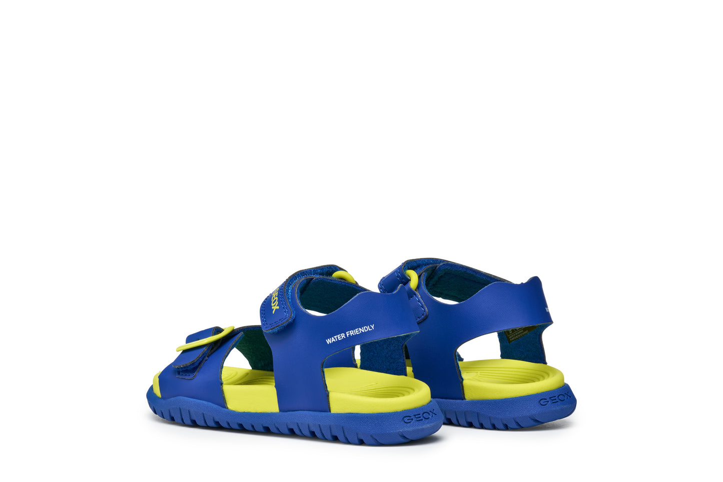 A boys sandal by Geox, style Fusbetto in royal blue and green with velcro strap and buckle at the front. Back view of pair