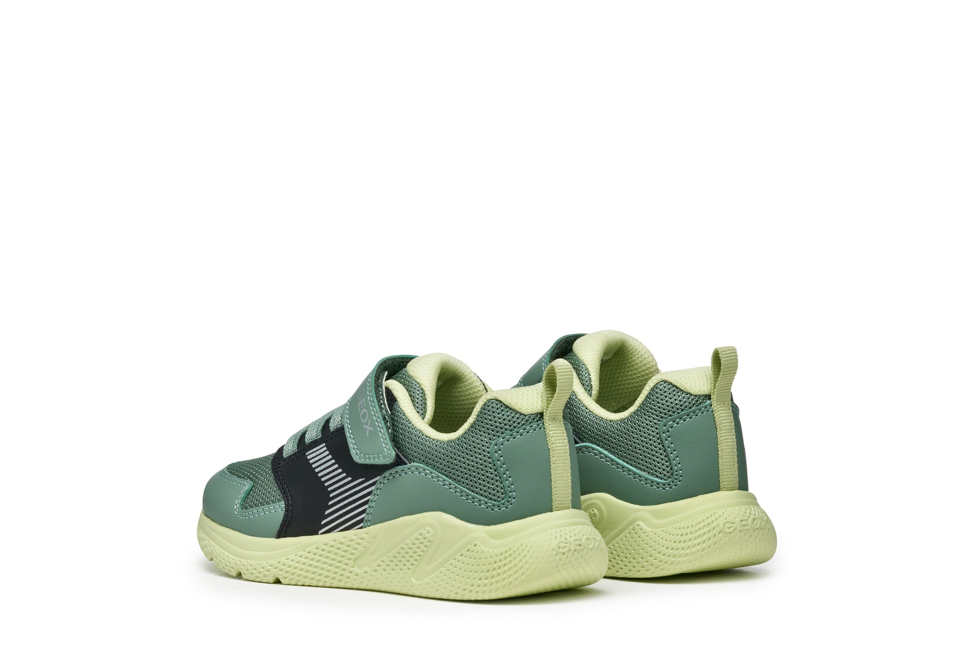 A boys trainer by Geox, style J Sprintye in black / green. Velcro/ elastic lace fastening. Angled back view.