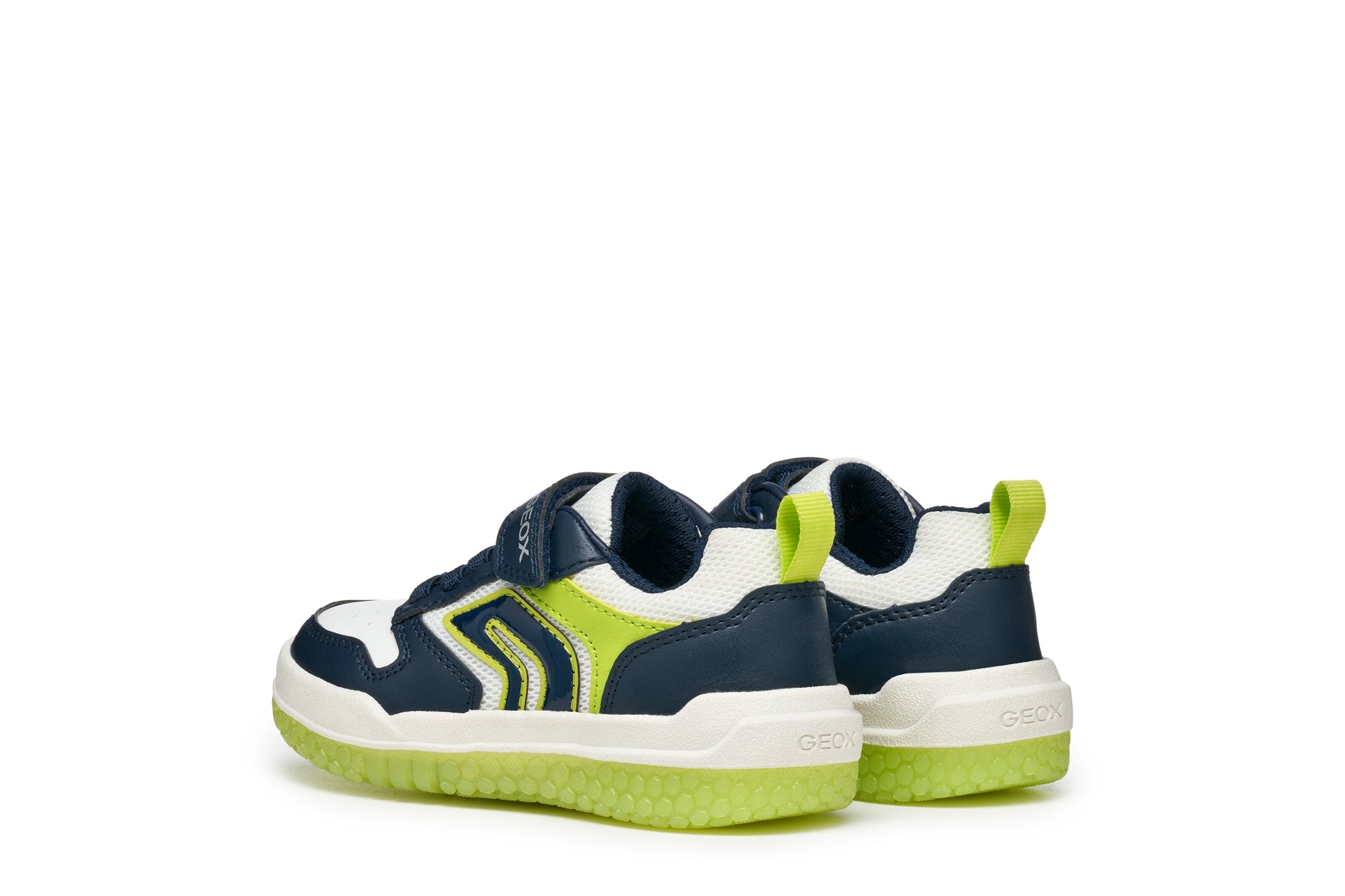 A boys light up trainer by Geox, style J Buzzerlight, in navy and lime with elastic lace and single velcro fastening. Angled view of a pair.