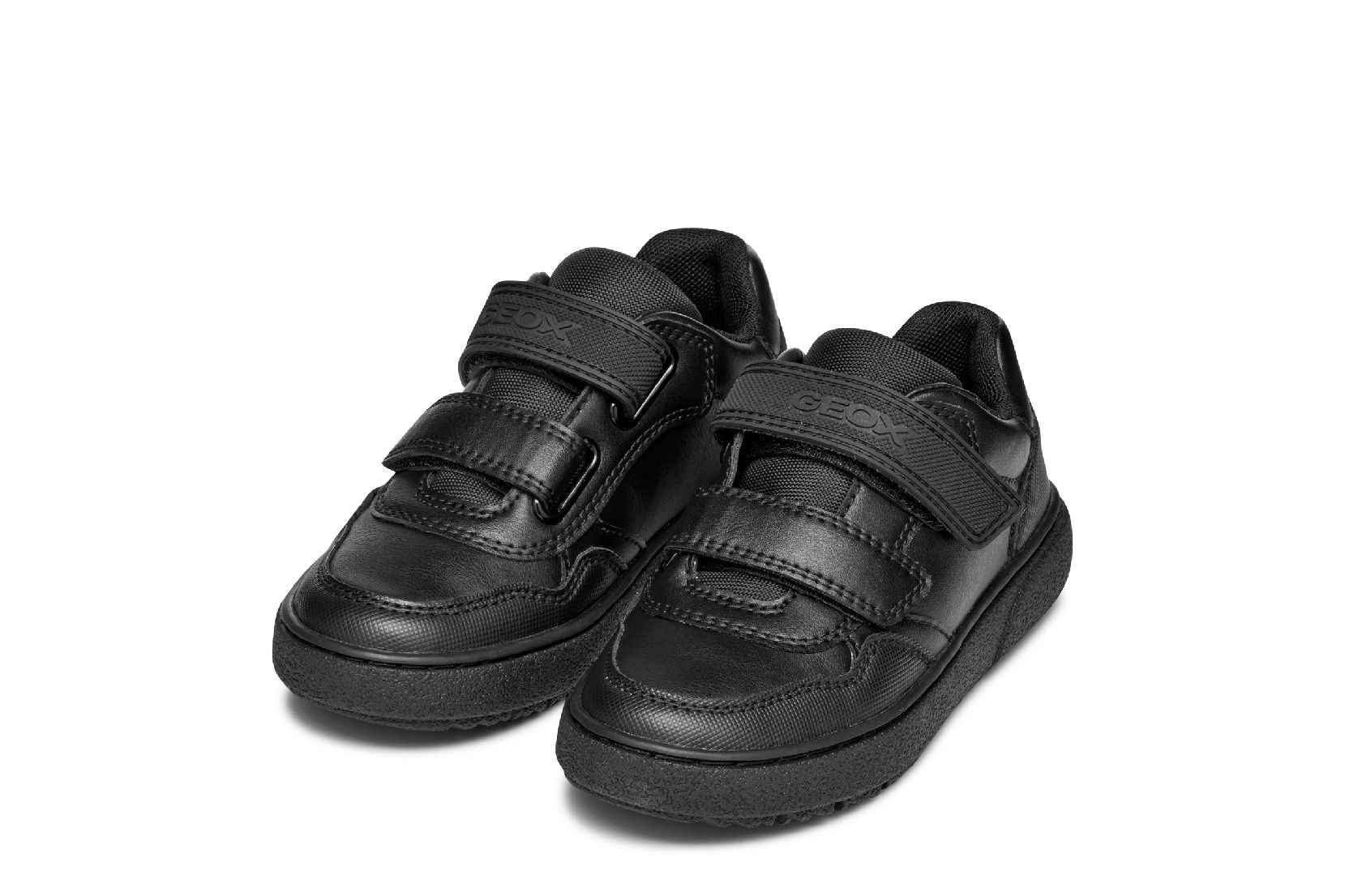 A boys casual school shoe by Geox, style Theleven, in black with double velcro fastening. Angled view of a pair.