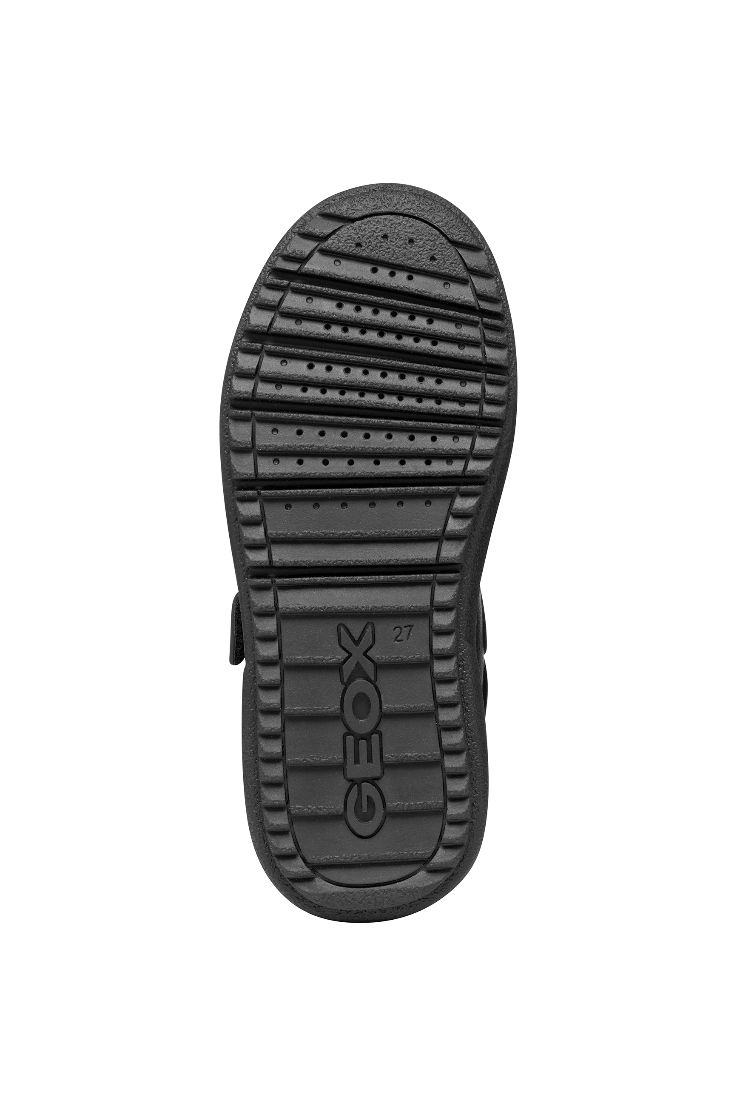 A boys casual school shoe by Geox, style Theleven, in black with double velcro fastening. View of sole.