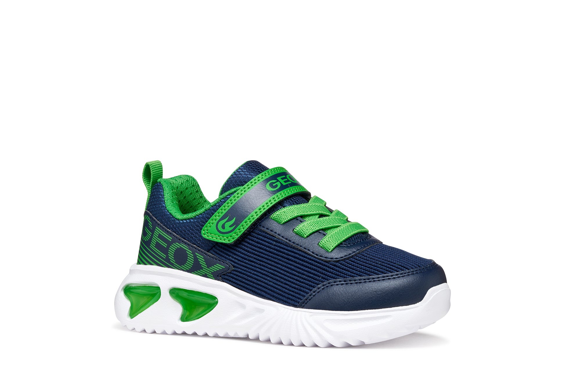 A boys trainer by Geox style Assister in navy/green with velcro strap, elastic laces, large geox logo on the side and lights in white sole. Right side view