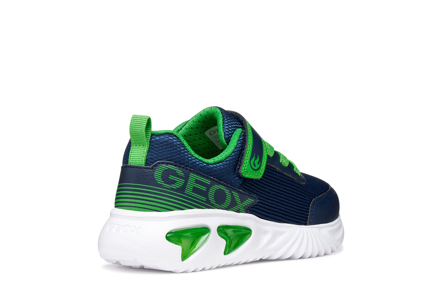 A boys trainer by Geox style Assister in navy/green with velcro strap, elastic laces, large geox logo on the side and lights in white sole. Outer back view