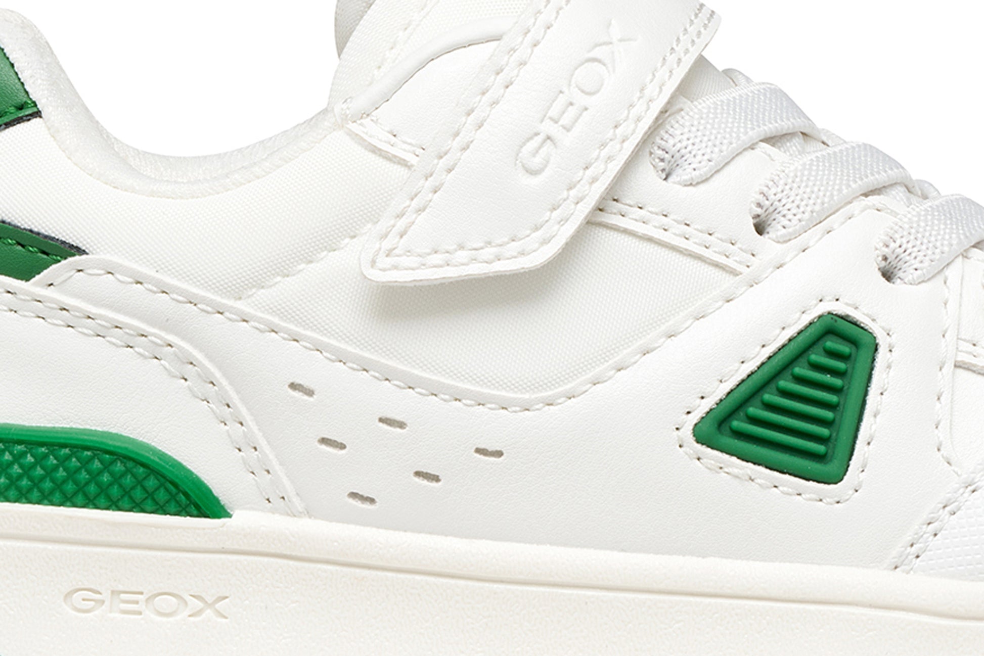 White and green sneaker with Geox branding on a white background